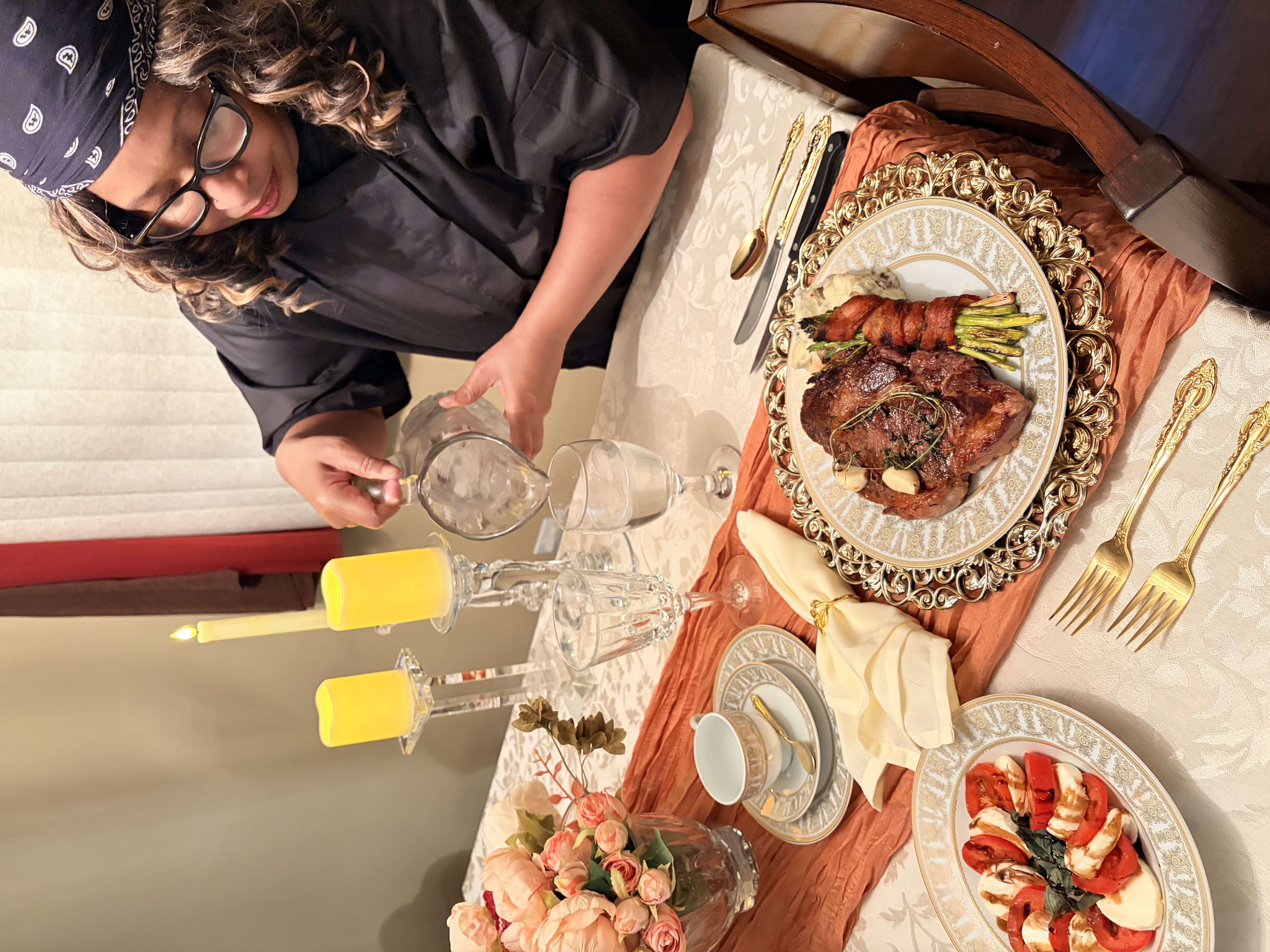 Chef Shorlanda serving water at an intimate steak dinner for two